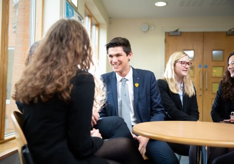 sixth form college social area with pupils A Level Politics
